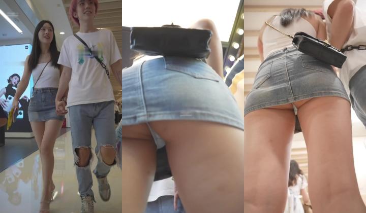 超短牛仔裙美女在商场 光脚穿袜子试鞋高跟鞋配玉足